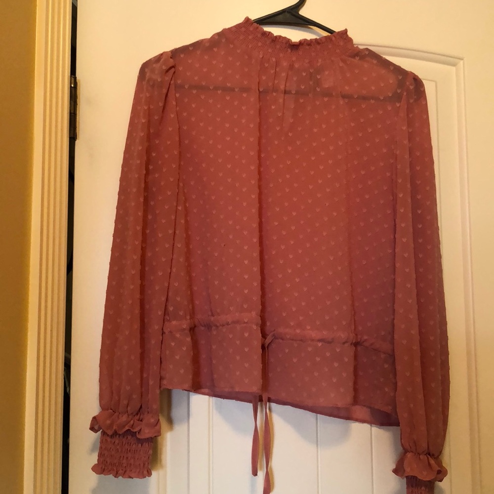 Divided pink blouse.
